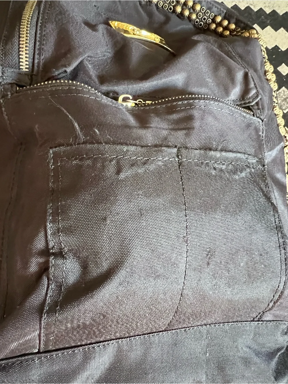 Jean Studded Backpack designed with an edgy  streetwear aesthetic.